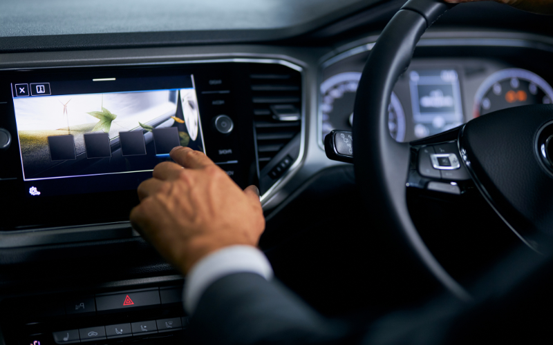 Driver operating multi-media touchscreen